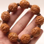 曜尊四面·Quadraja — Four-Faced Buddha Bracelet | 20 Short Round Iron Stone Olive Seeds · Hu Carving Strand
