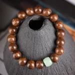 曜香映曜·Glowdanura — Golden Sandalwood Buddha Bead Bracelet | Smooth Pattern · Luminous Stone Accent · Unisex Fashion Jewelry - Image 6