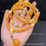 Huīyàn Luòyǔ(晖琰落玉) · Hetianara — Beeswax Backflow Pendant | 108 Old-Styled Amber Beads · Water Drop Geometry · Punk Ethnic Jewelry with Natural Turquoise