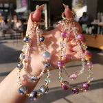 Xīngyǔ Huāliàn(星语花链) · NoEnName_Null — Starry Sky Pearl Crystal Phone Chain | Boutique Handmade Wrist Pendant · Light Luxury Beaded Accessory for Women
